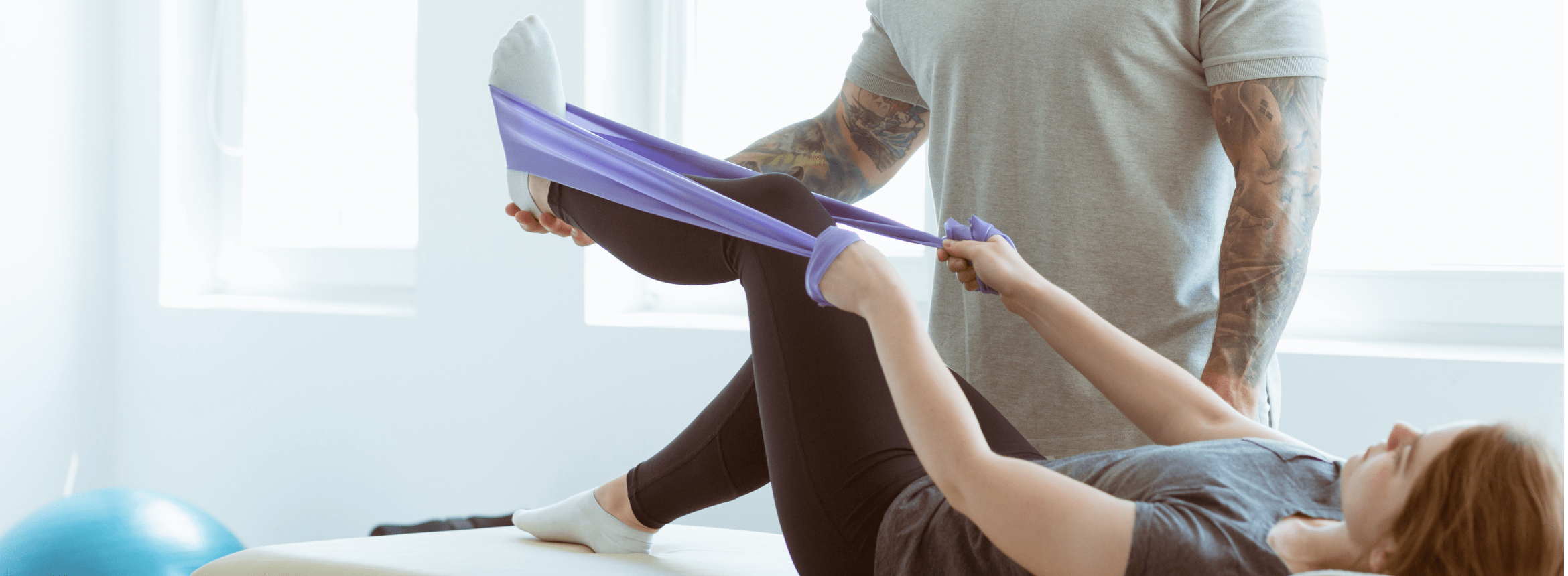 physiotherapist stretching leg